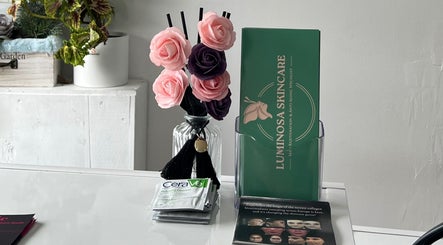 Elegant skincare brochures and rose decor at Andreea Arcalianu, Dagenham, England, GB.