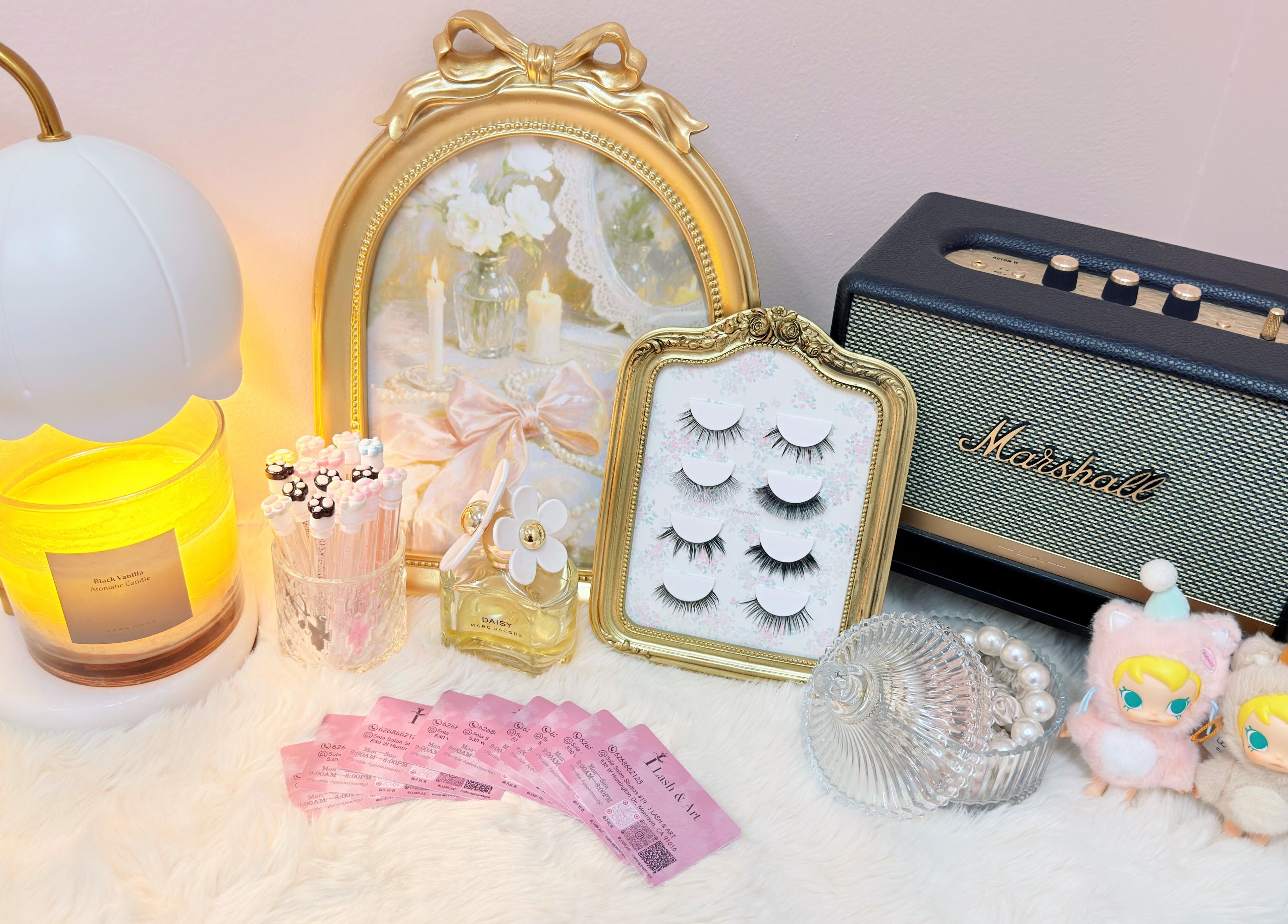 Elegant display with lashes, candles, and decor at I Lash & Art, Monrovia, California, US.