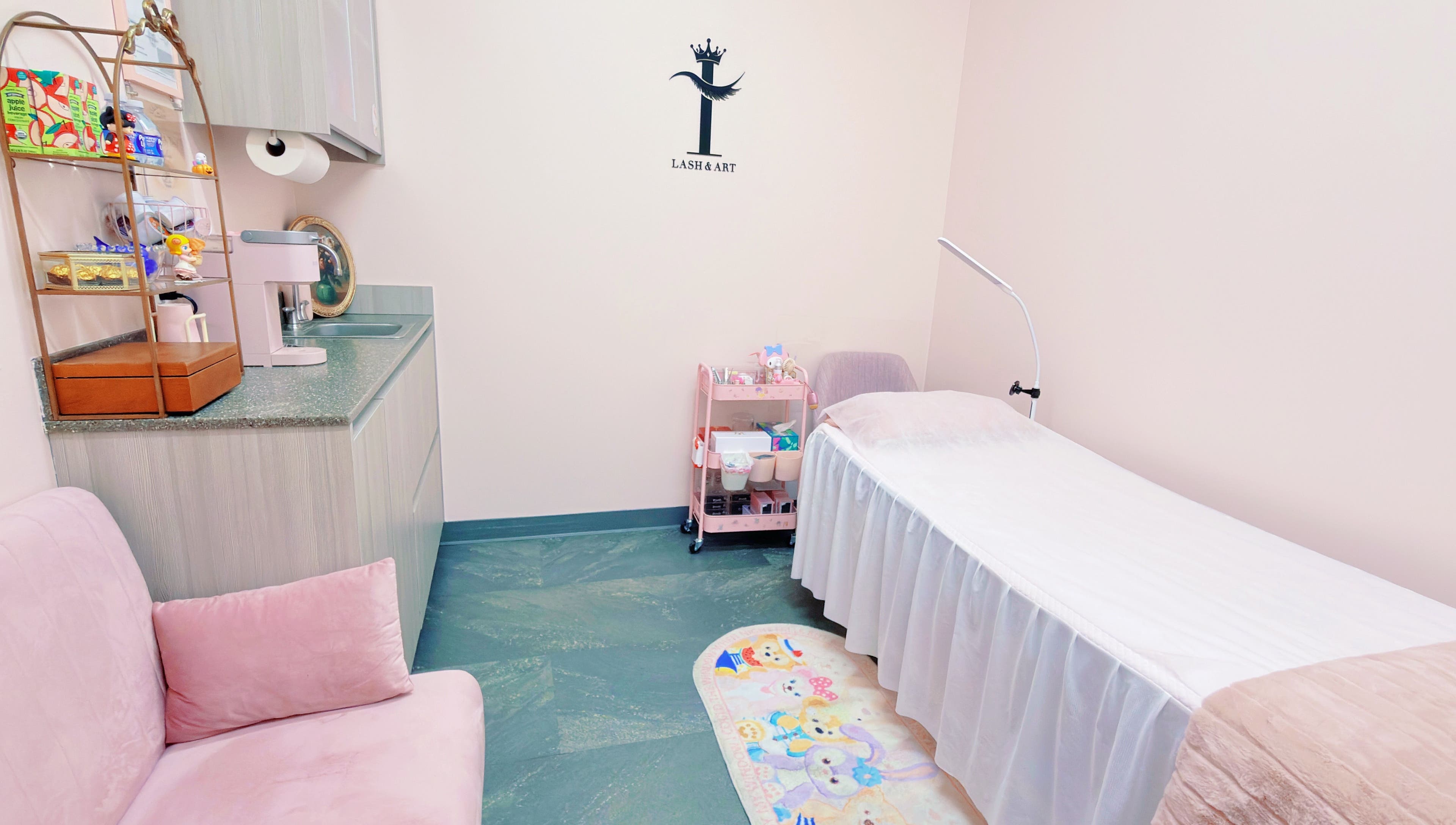 Cozy and serene beauty treatment room at I Lash & Art, Monrovia, California, US, featuring soft pink decor.