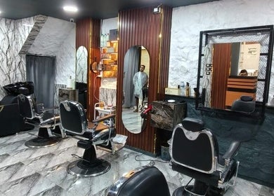 Elegant beauty salon interior at Boss Cut, Cairo Governorate, EG, with modern styling chairs and mirrors.