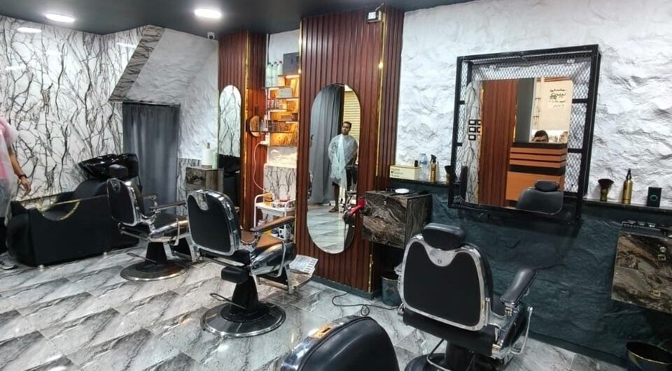 Elegant beauty salon interior at Boss Cut, Cairo Governorate, EG, with modern styling chairs and mirrors.