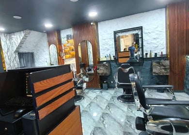 Modern interior of Boss Cut salon in Cairo Governorate, Cairo Governorate, EG, featuring stylish seating and decor.