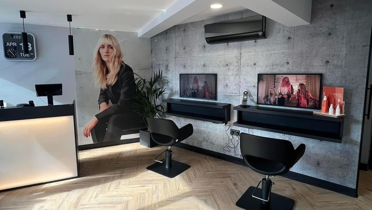 Modern salon interior at Bangs Salon Tutbury, Tutbury, England, GB, featuring sleek chairs and stylish decor.
