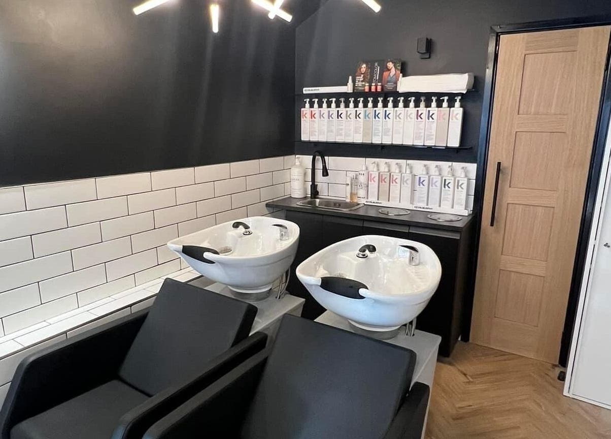 Modern wash stations at Bangs Salon Tutbury, Tutbury, England, GB, featuring sleek sinks and a chic interior.
