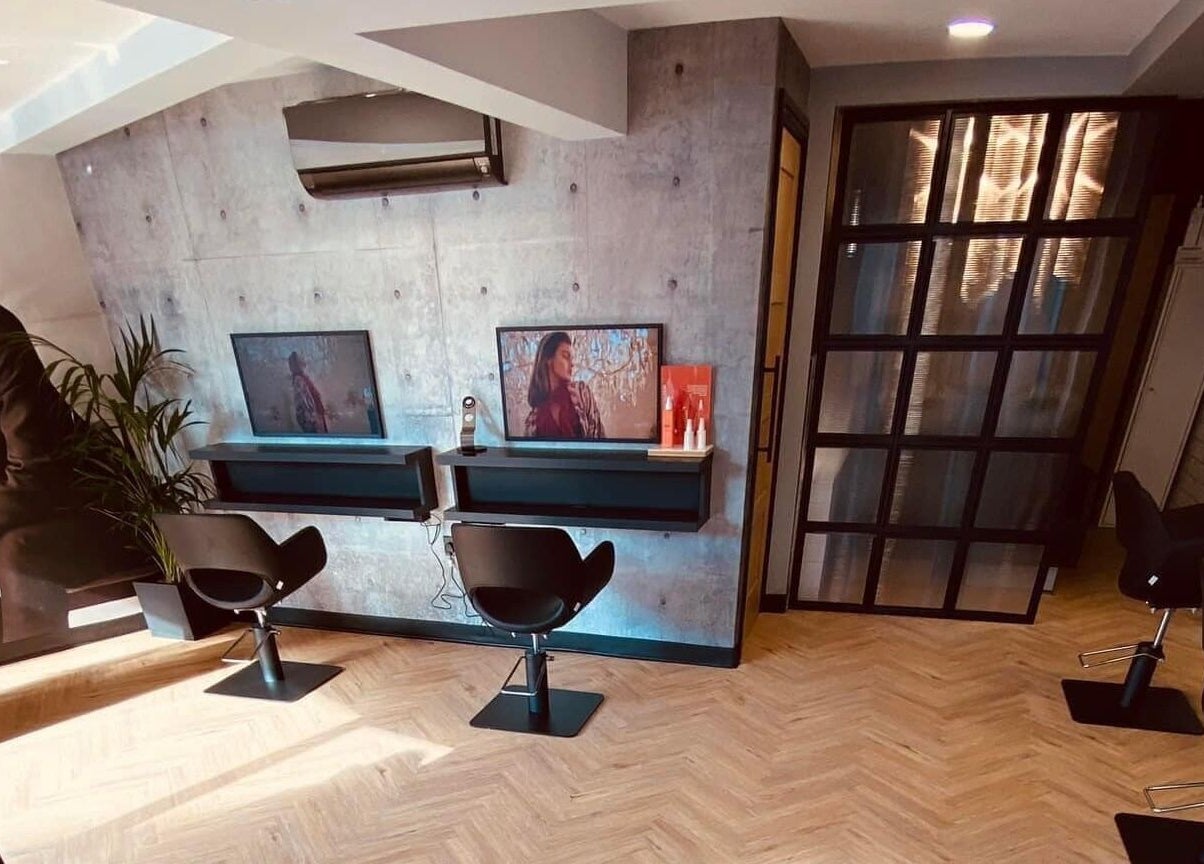 Modern hairdressing stations at Bangs Salon Tutbury, Tutbury, England, GB with stylish decor and seating.