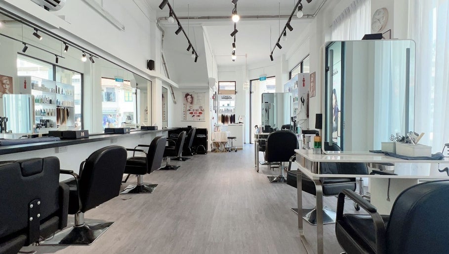 Modern, spacious interior of JT Hair and Beauty Salon in Singapore, SG with sleek, stylish décor and seating.