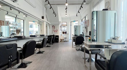 Modern, spacious interior of JT Hair and Beauty Salon in Singapore, SG with sleek, stylish décor and seating.