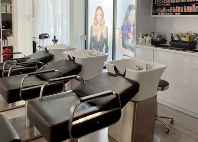 Modern wash stations at JT Hair and Beauty Salon, Singapore, Singapore, SG, showcasing sleek salon design.