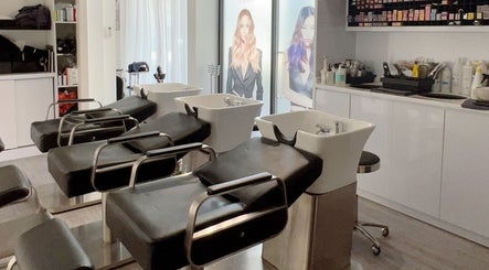 Modern wash stations at JT Hair and Beauty Salon, Singapore, Singapore, SG, showcasing sleek salon design.