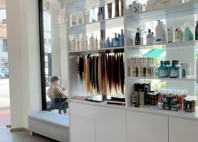 Product display at JT Hair and Beauty Salon, Singapore, SG showcasing hair products and extensions.