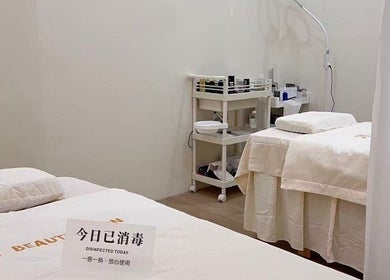 Tranquil therapy room at JT Hair and Beauty Salon, Singapore, SG, showcasing disinfected treatment beds.