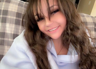 Smiling person indoors at Nails by Paige in Payson, Arizona, US, showcasing cozy ambiance.