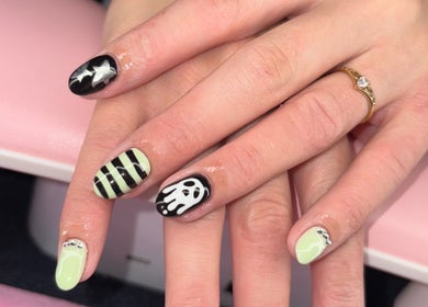 Halloween-themed nail art featuring ghosts and stripes at Nails by Paige in Payson, Arizona, US.