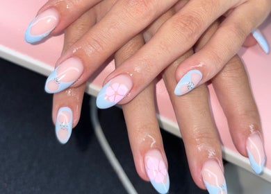 Elegant pastel blue floral nail art by Nails by Paige in Payson, Arizona, US, showcasing delicate designs.