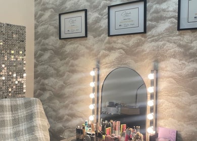 Makeup station at nadinenixonbeauty in Portadown, Northern Ireland, GB featuring illuminated mirror and certificates.