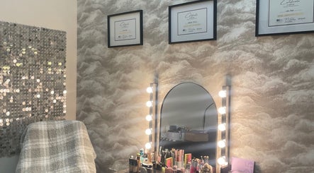 Elegant beauty station at nadinenixonbeauty, Portadown, Northern Ireland, GB with makeup tools and lighted mirror.