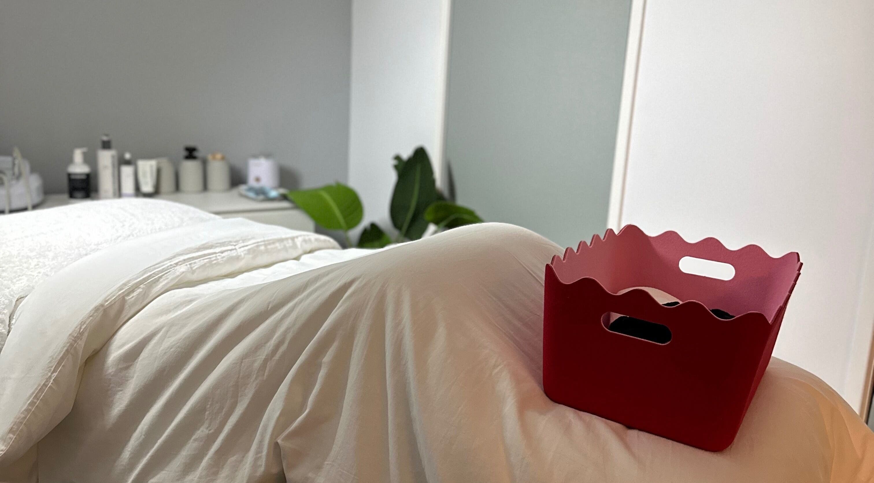 Cozy treatment room at byKT, Redland Bay, Queensland, AU, featuring plush bedding and ambient decor.