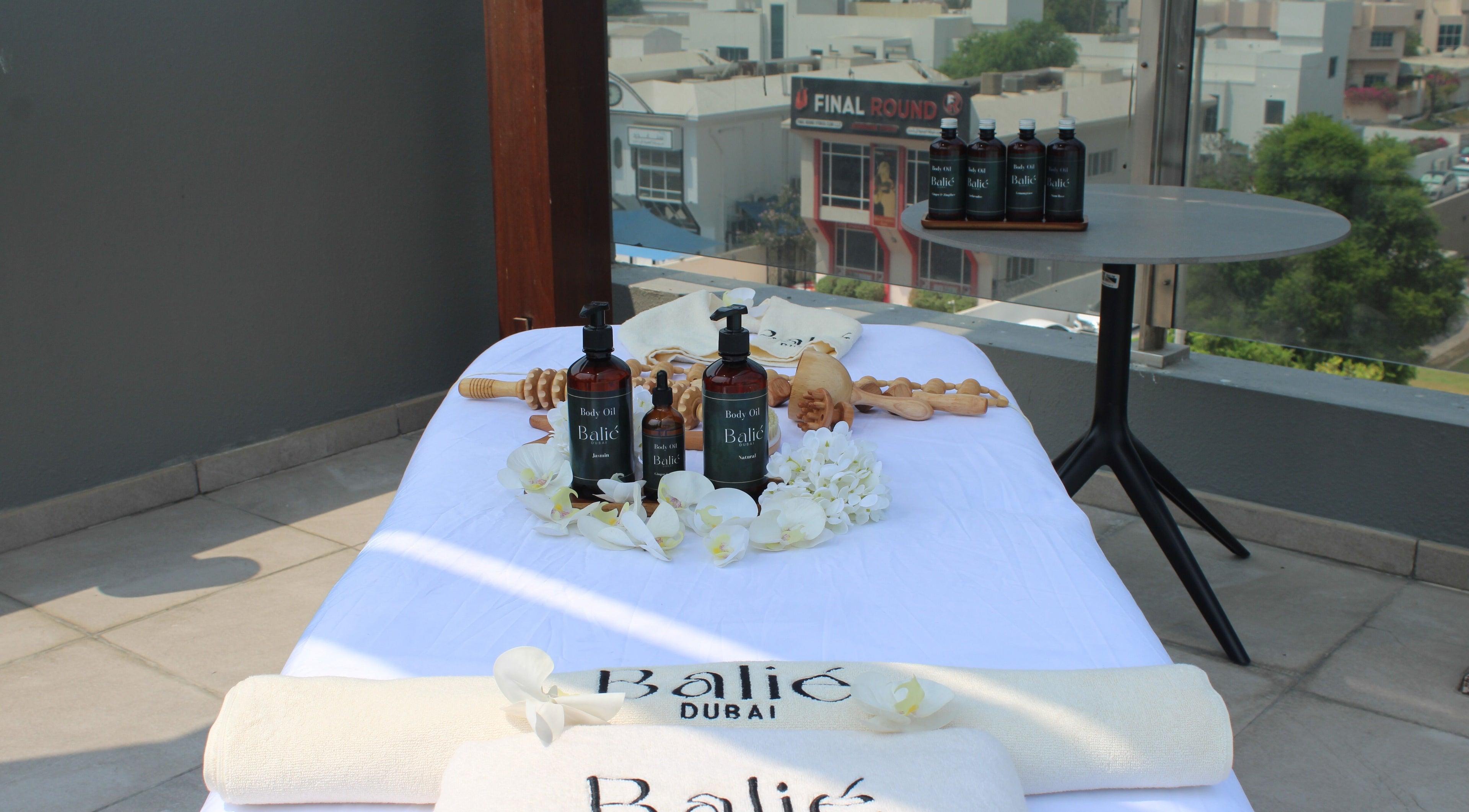 Relaxing spa setup on Balié's terrace in Dubai, Dubai, AE, featuring oils and massage tools.
