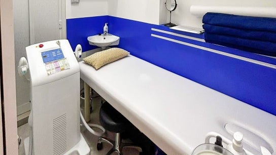 Cozy treatment room at Wax Factor Tanjong Pagar, Singapore, Singapore, SG with plush bed and modern equipment.