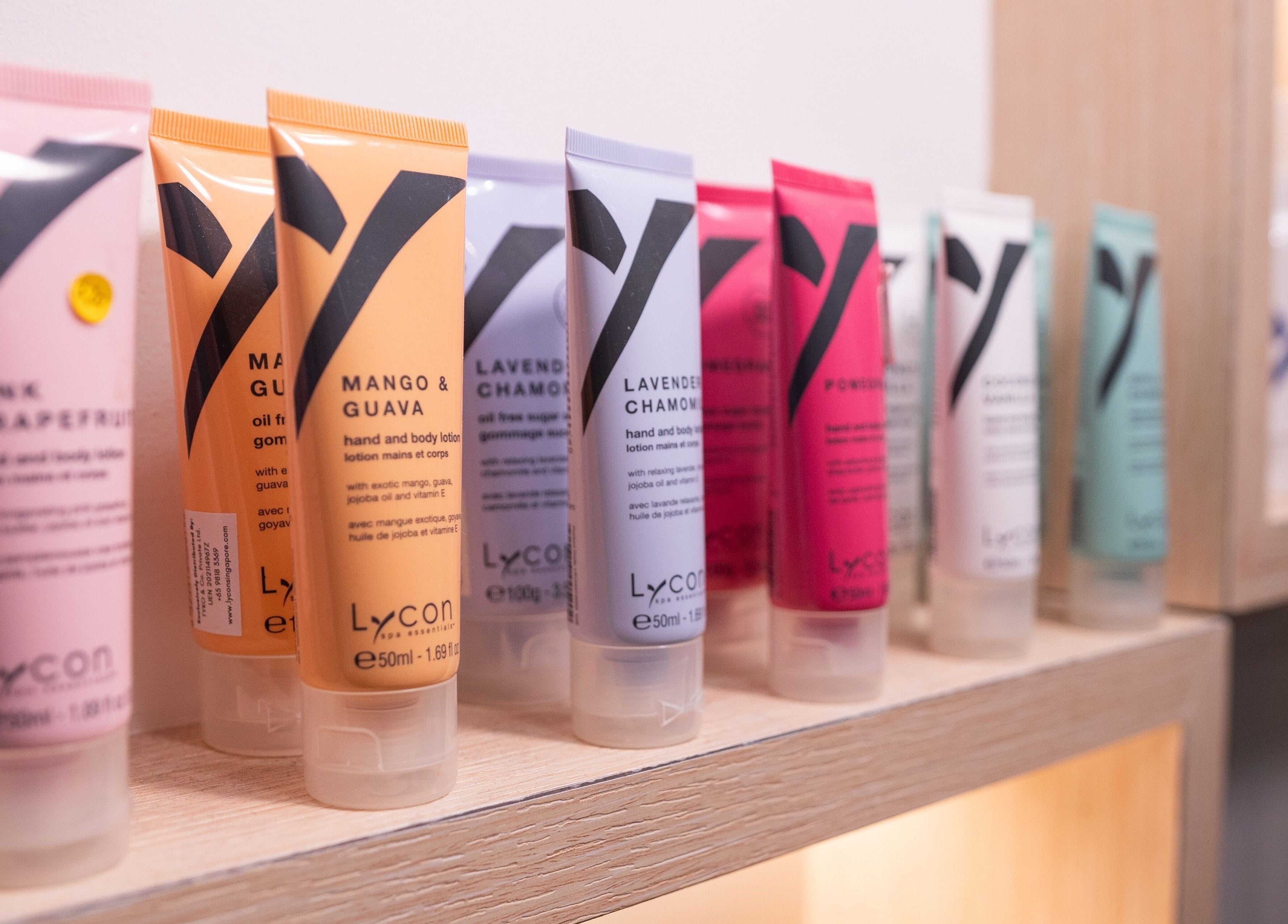 Assorted skincare lotions at Wax Factor Tanjong Pagar, Singapore, SG showcase vibrant colors and variety.