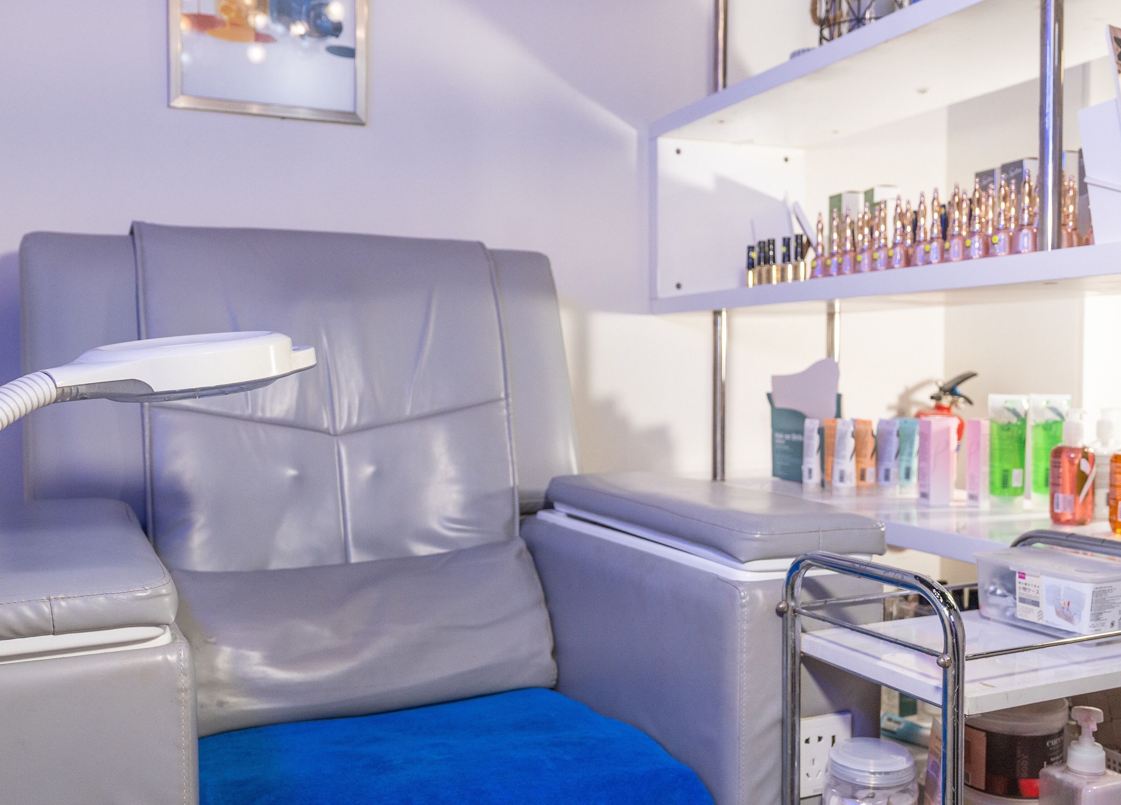 Relaxing treatment chair at Wax Factor Orchard Central, Singapore, SG, surrounded by wellness products.