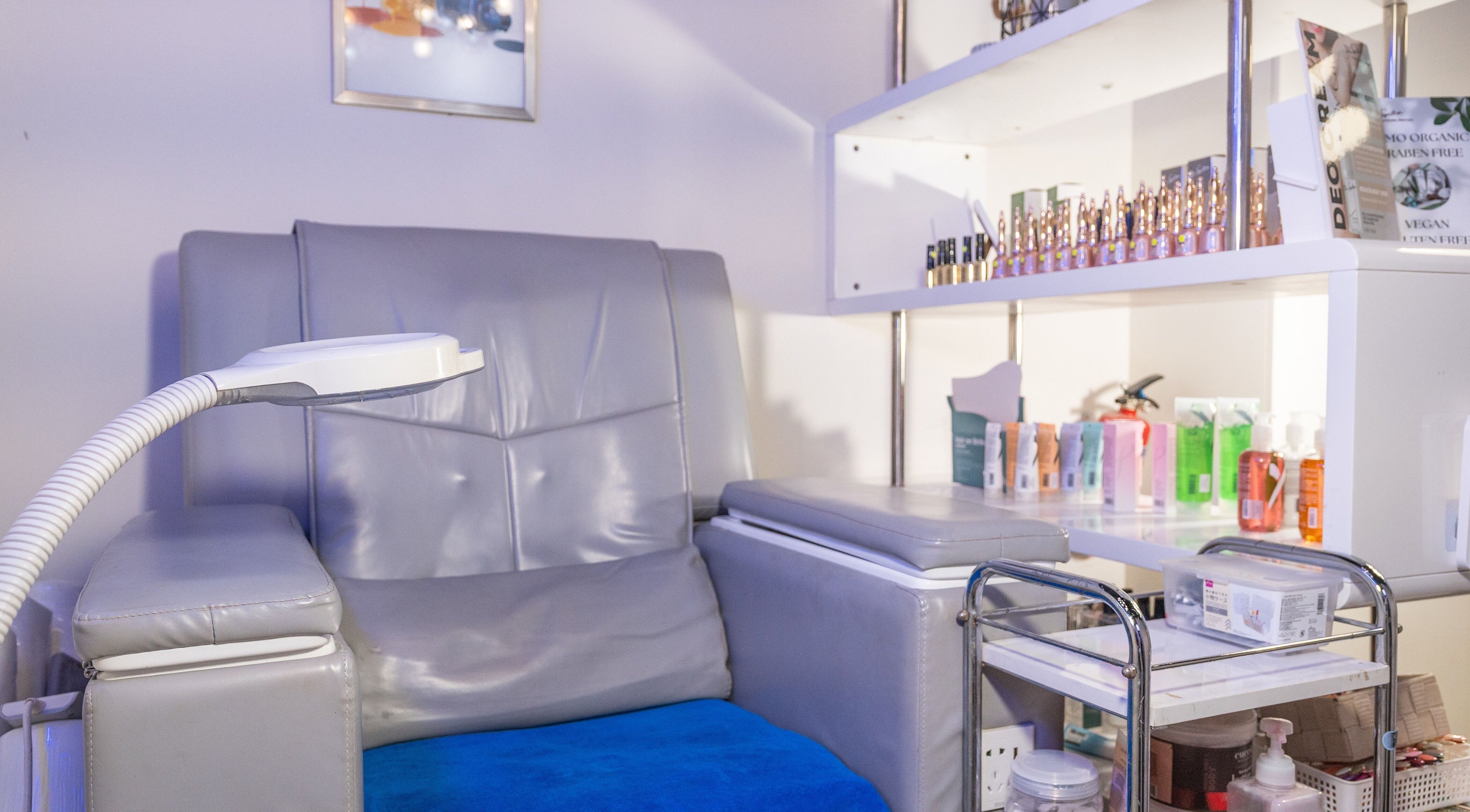 Relaxing treatment chair at Wax Factor Orchard Central, Singapore, SG, surrounded by wellness products.