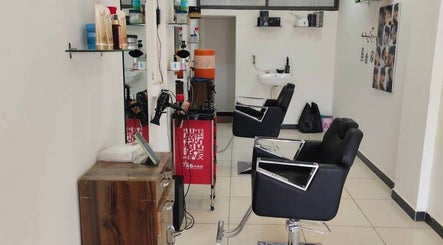 Modern salon chairs at Sunrise Hair Salon, Uchimandal Morbi-2, Gujarat, IN. Stylish haircare setting.