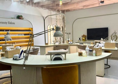 Bright, modern nail workspace at Nails Eleven Salon, Dubai, AE featuring stylish decor and manicure stations.