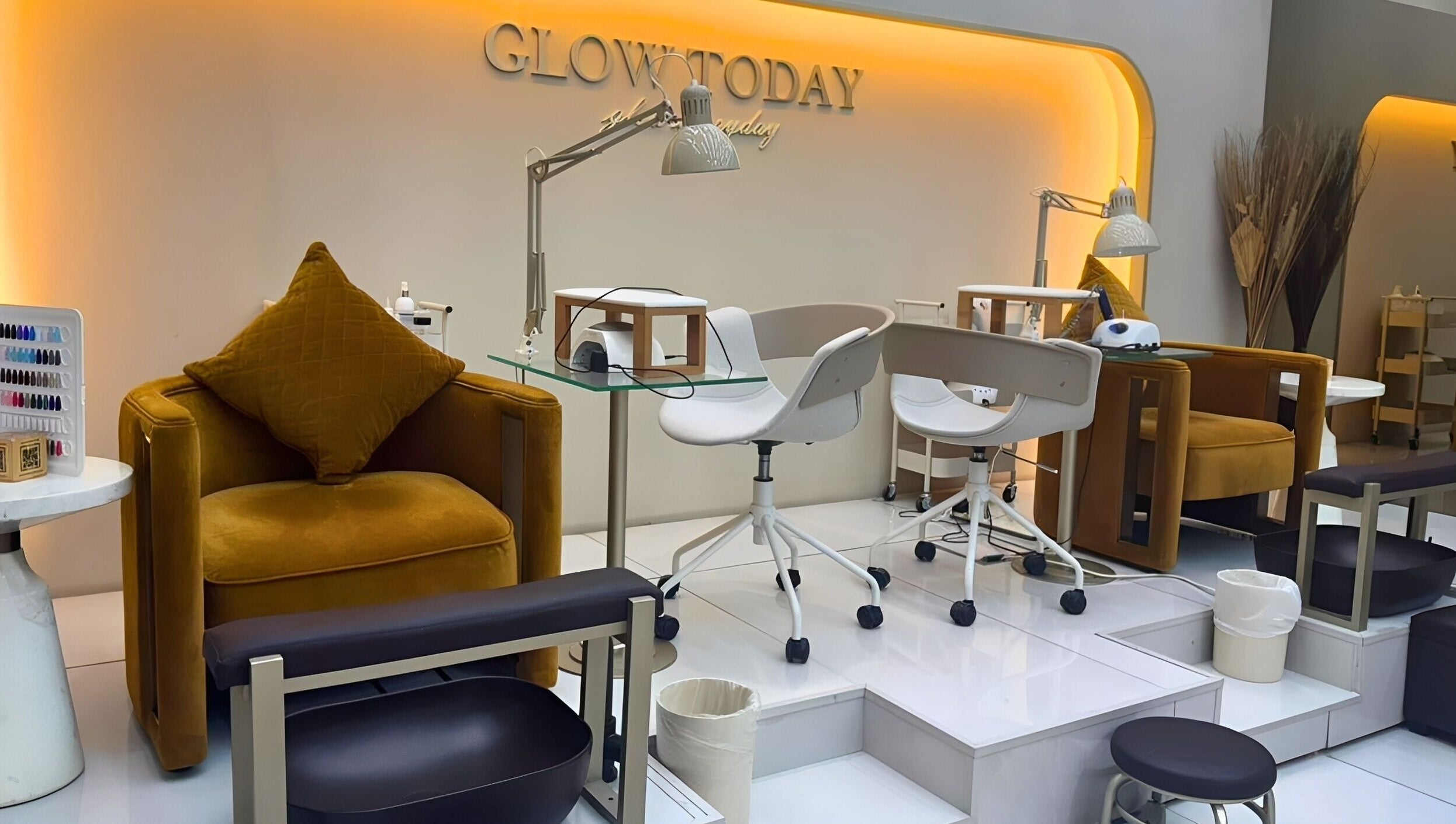 Chic nail station at Nails Eleven Salon, Dubai, AE with modern chairs and warm lighting.
