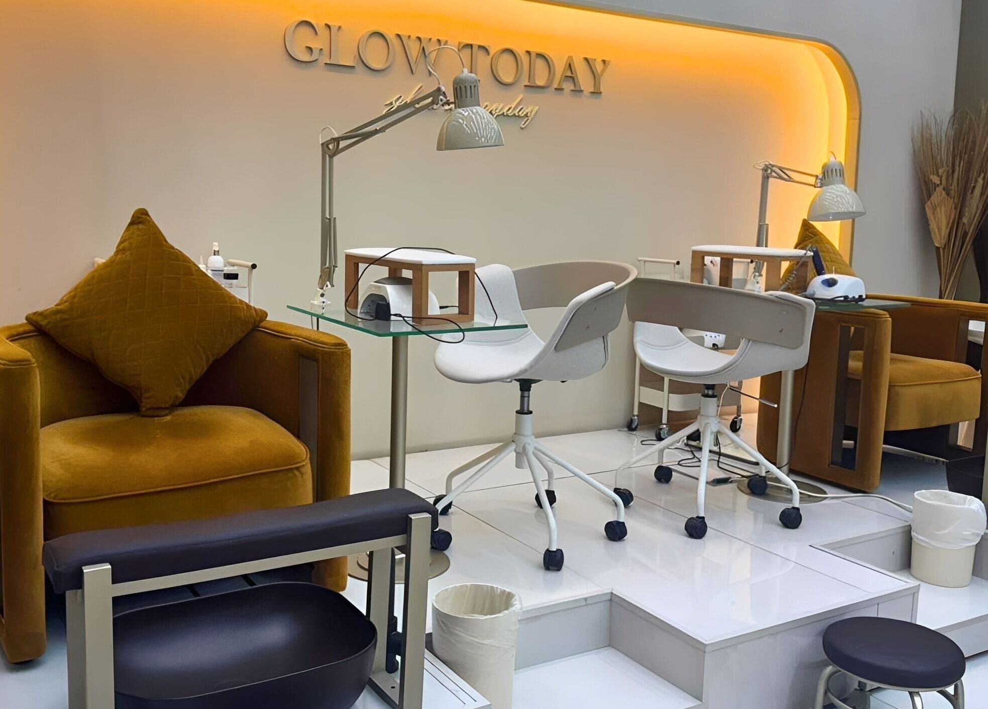 Chic nail station at Nails Eleven Salon, Dubai, AE with modern chairs and warm lighting.