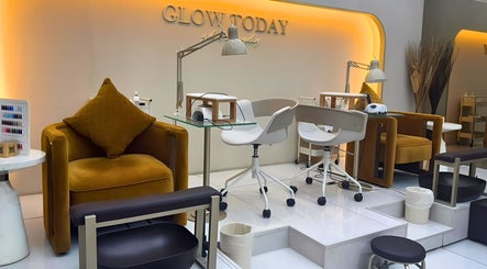 Chic nail station at Nails Eleven Salon, Dubai, AE with modern chairs and warm lighting.