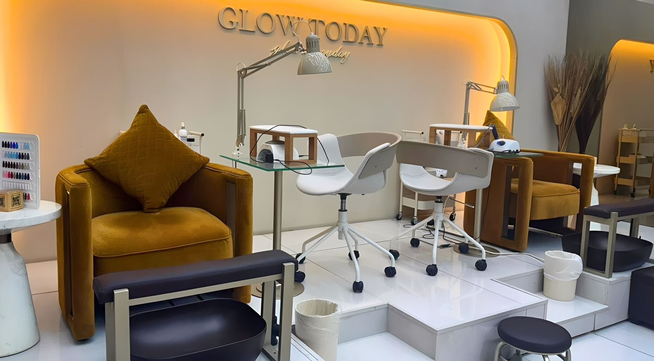 Chic nail station at Nails Eleven Salon, Dubai, AE with modern chairs and warm lighting.