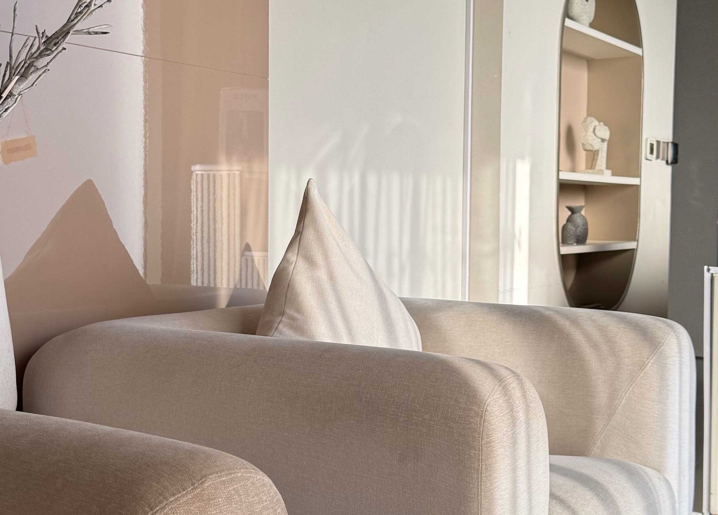 Cozy seating area at Nails Eleven Salon, Dubai, AE, featuring soft beige furniture and modern decor.