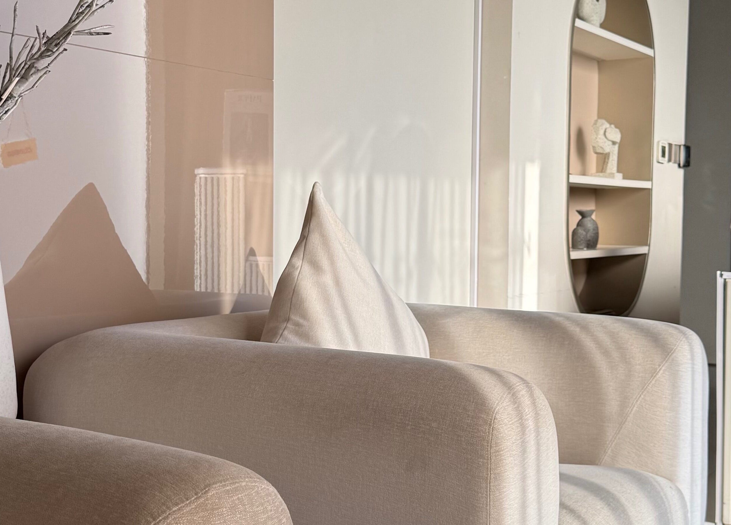 Cozy seating area at Nails Eleven Salon, Dubai, AE, featuring soft beige furniture and modern decor.