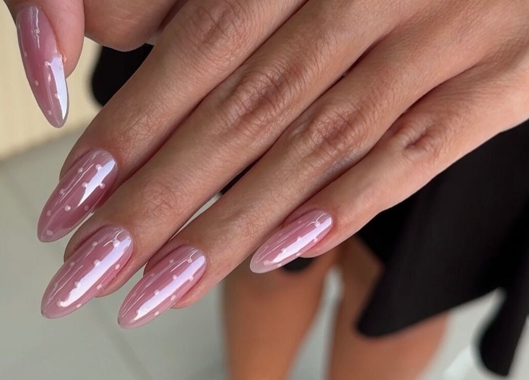 Stylish pink nails with dots at Nails Eleven Salon, Dubai, AE.