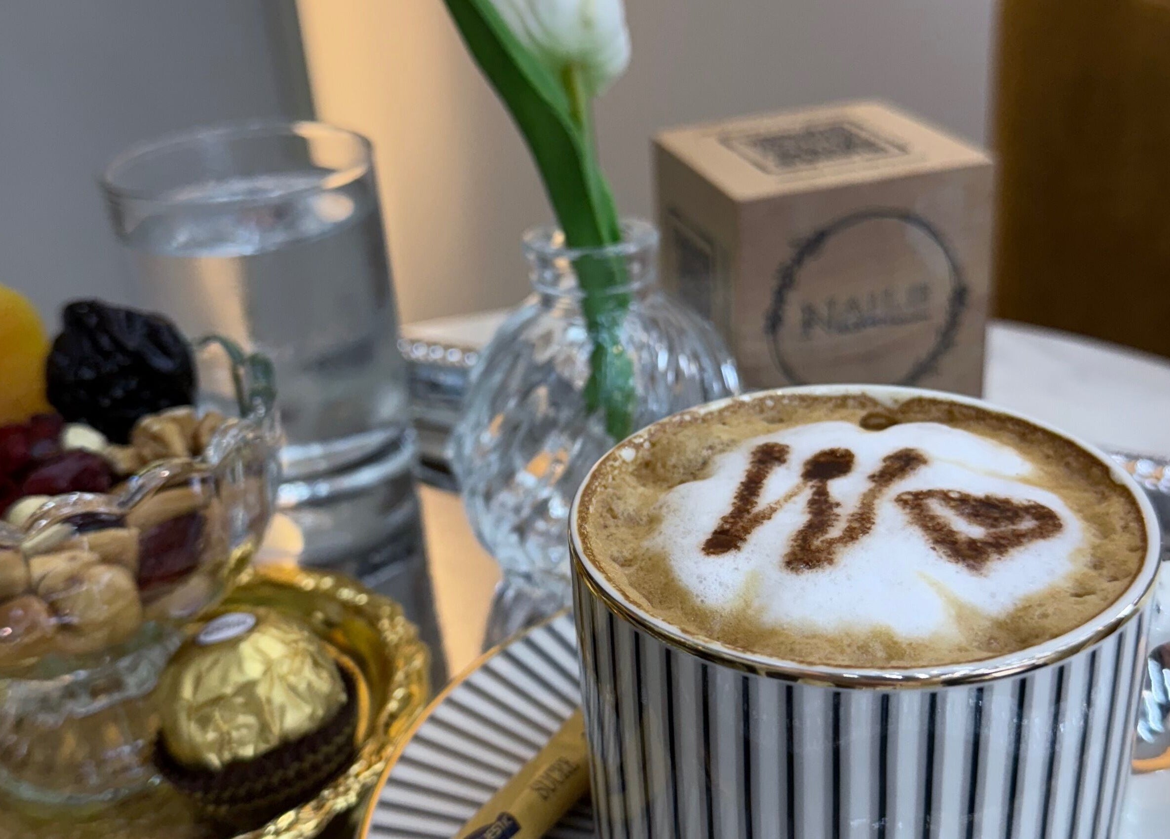 Gourmet coffee with a heart design at Nails Eleven Salon, Dubai, AE, offering a sophisticated experience.