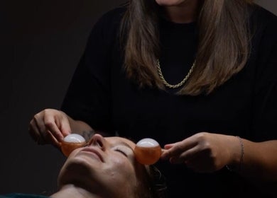 Facial treatment with ice globes at The Beauty Bar by Phoebe, Groombridge, England, GB for ultimate relaxation.