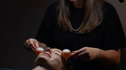 Facial treatment with ice globes at The Beauty Bar by Phoebe, Groombridge, England, GB for ultimate relaxation.