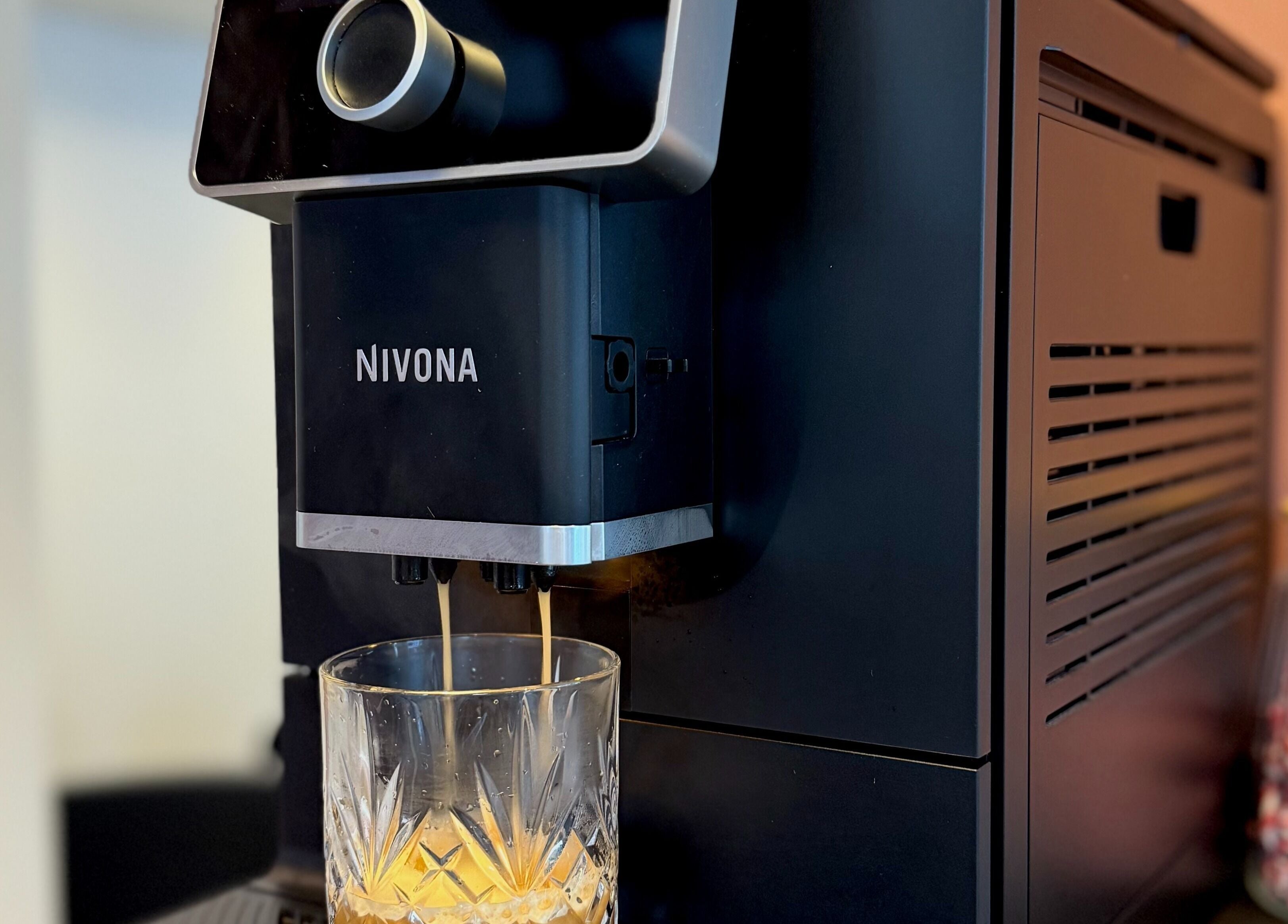 Coffee machine at Salong Rót, Tórshavn, Streymoyar, FO, pouring espresso into a glass.