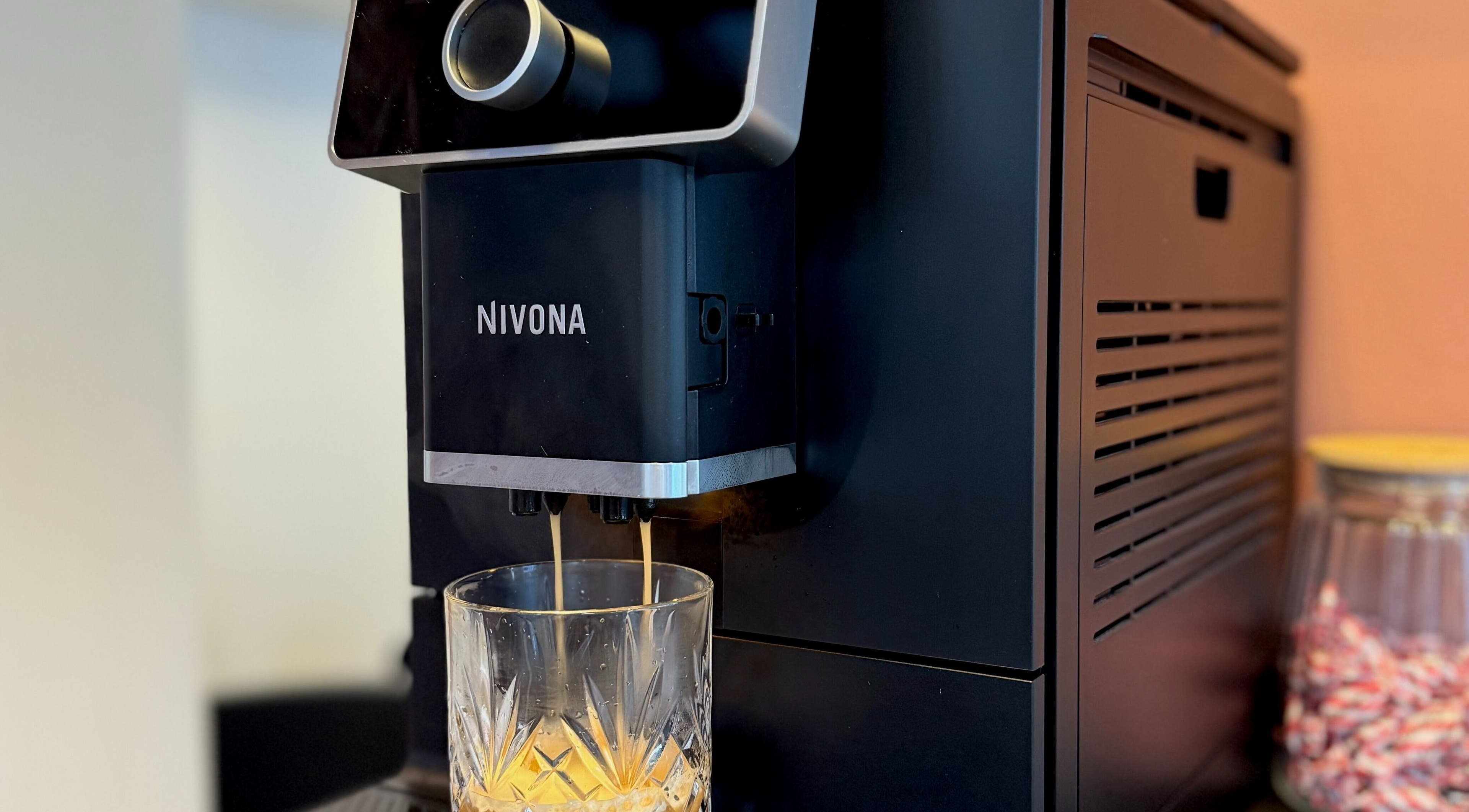 Coffee machine at Salong Rót, Tórshavn, Streymoyar, FO, pouring espresso into a glass.