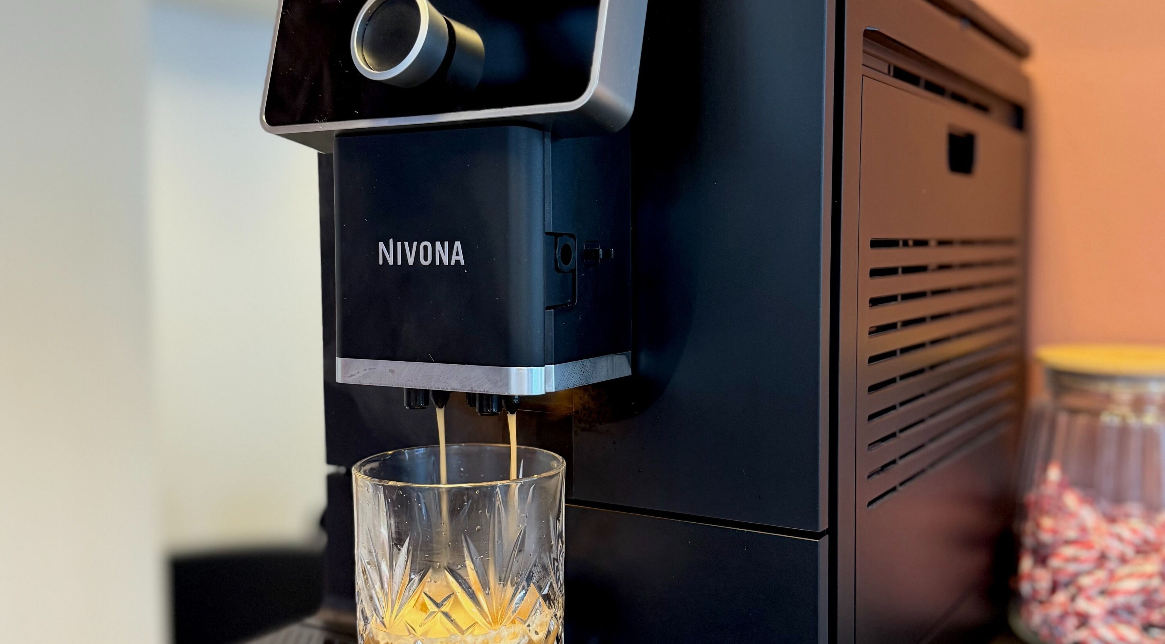 Coffee machine at Salong Rót, Tórshavn, Streymoyar, FO, pouring espresso into a glass.