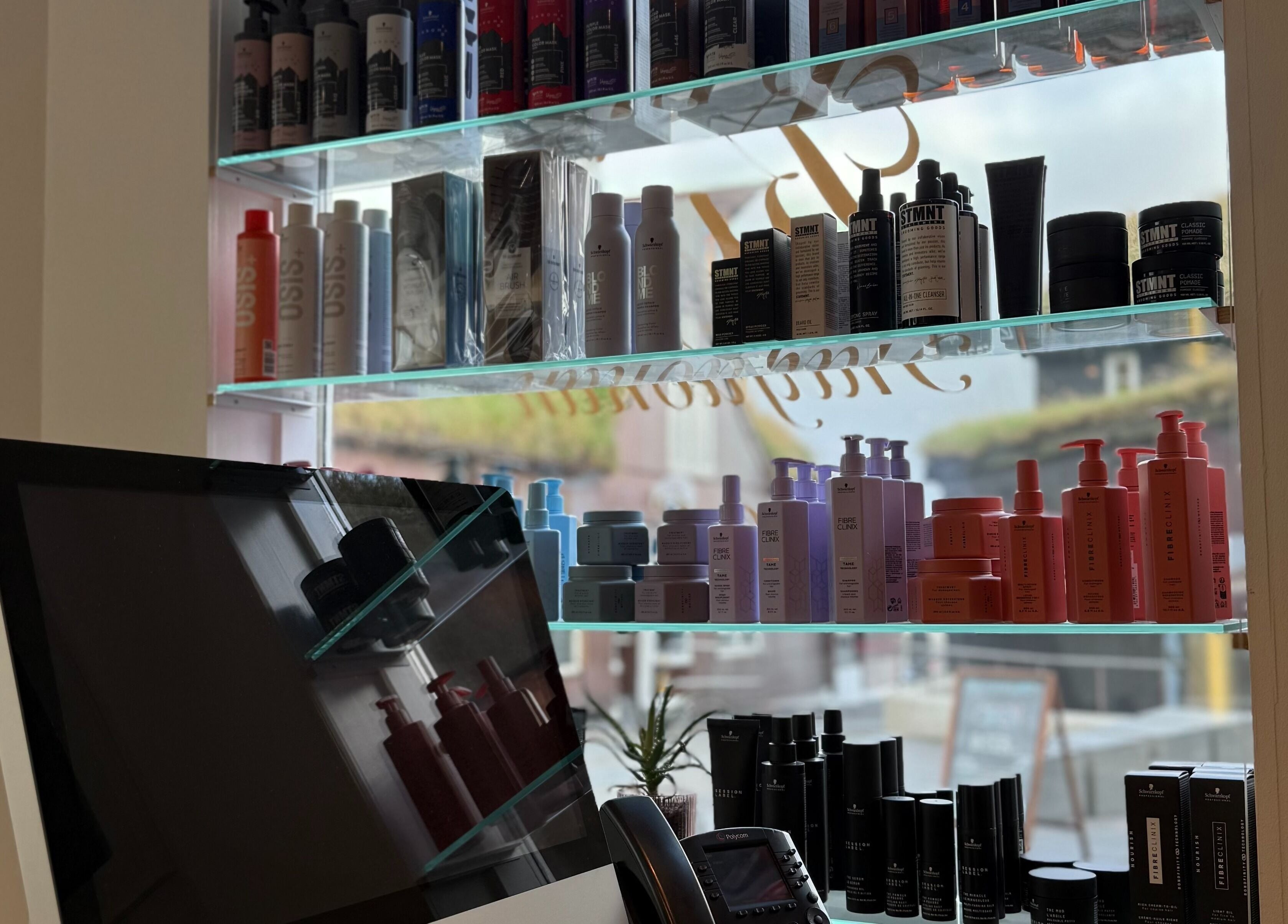 Shelves with beauty products at Salong Rót, Tórshavn, Streymoyar, FO, showcasing salon's diverse offerings.