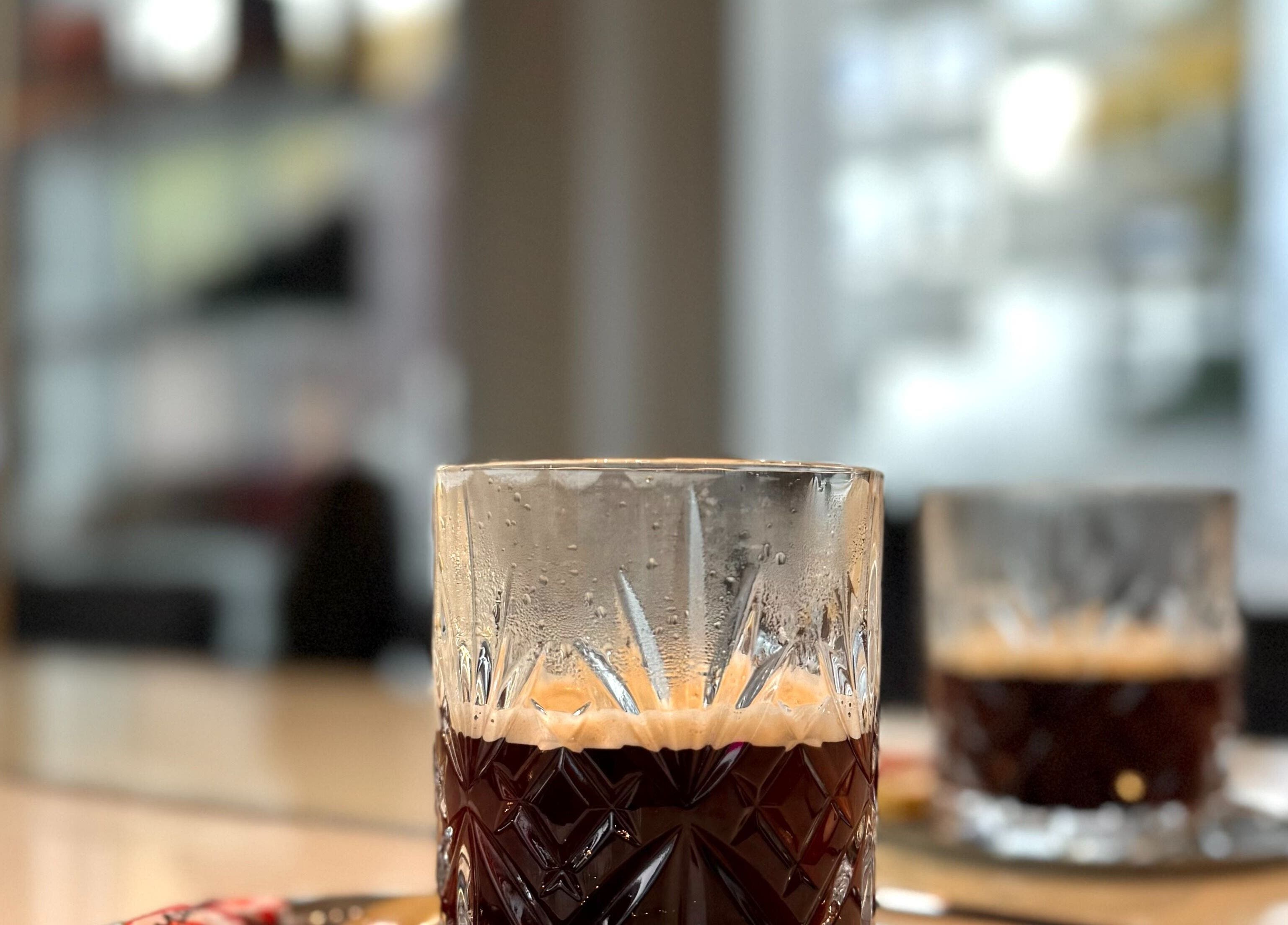 Elegant crystal glass with coffee at Salong Rót, Tórshavn, Streymoyar, FO, enhancing the stylish ambiance.