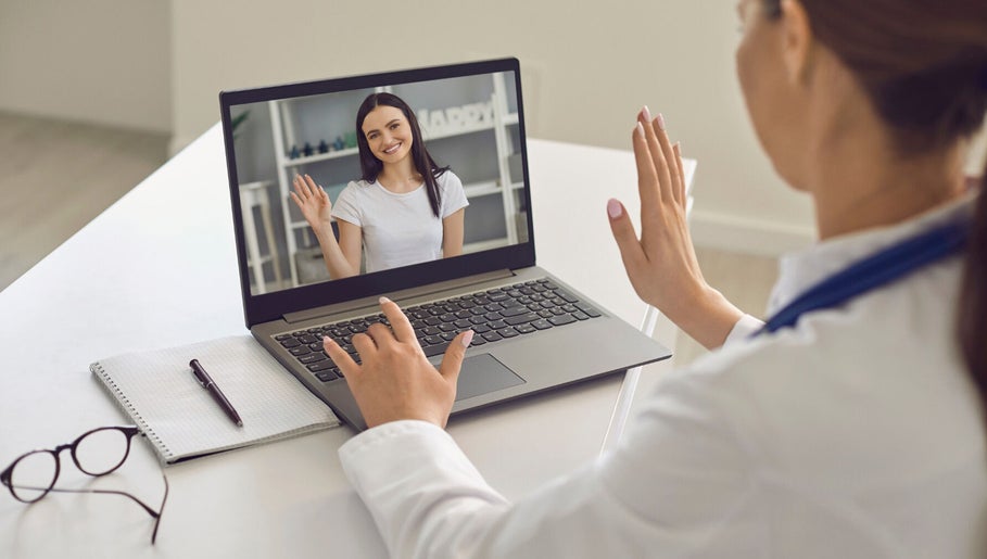 Virtual consultation at Pharmable, London, GB, with a smiling woman on a laptop screen.