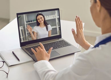 Virtual consultation at Pharmable, London, GB, with a smiling woman on a laptop screen.