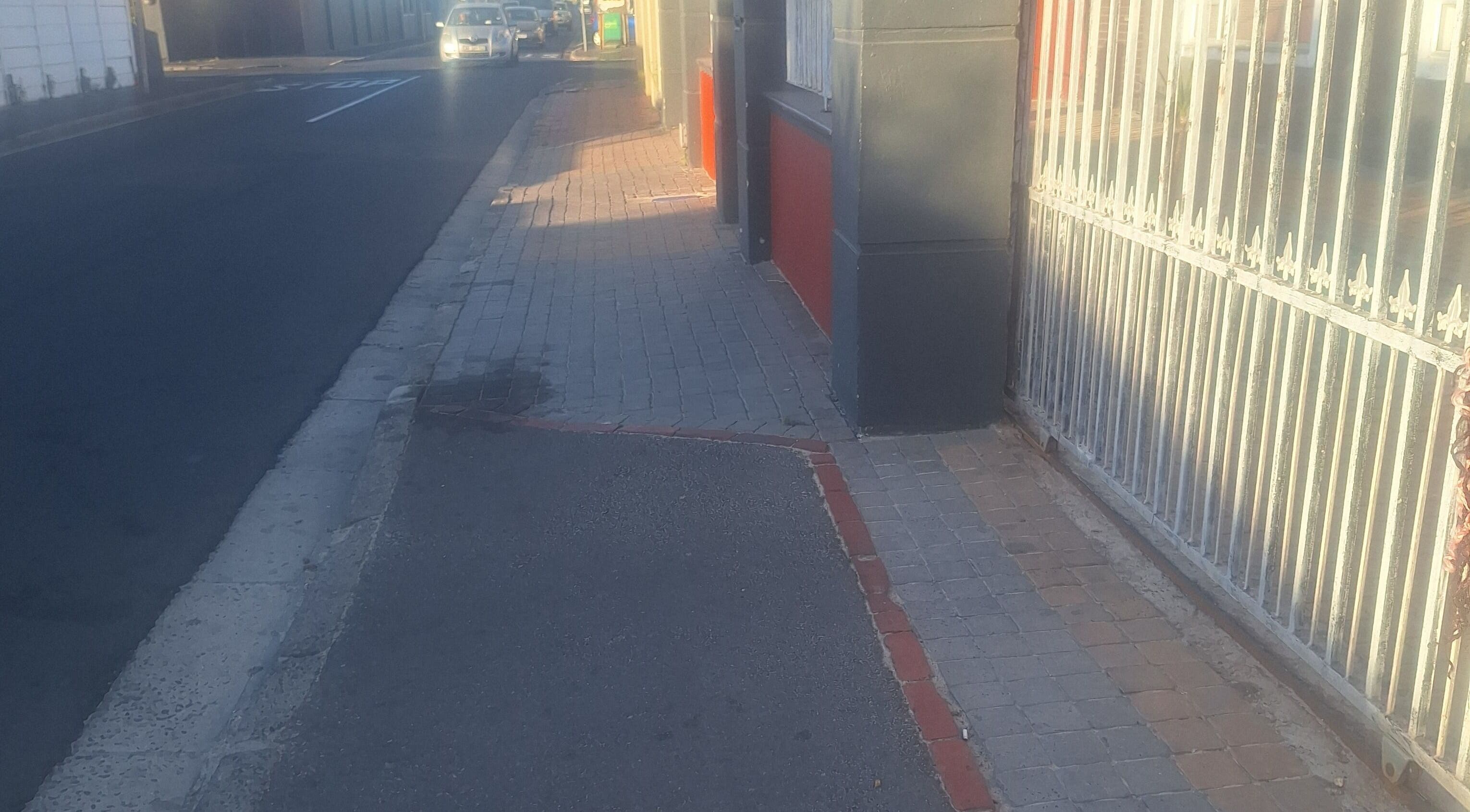 Sidewalk view near Nene's Beauty Mobile Spa, Cape Town, Western Cape, ZA with urban street elements.