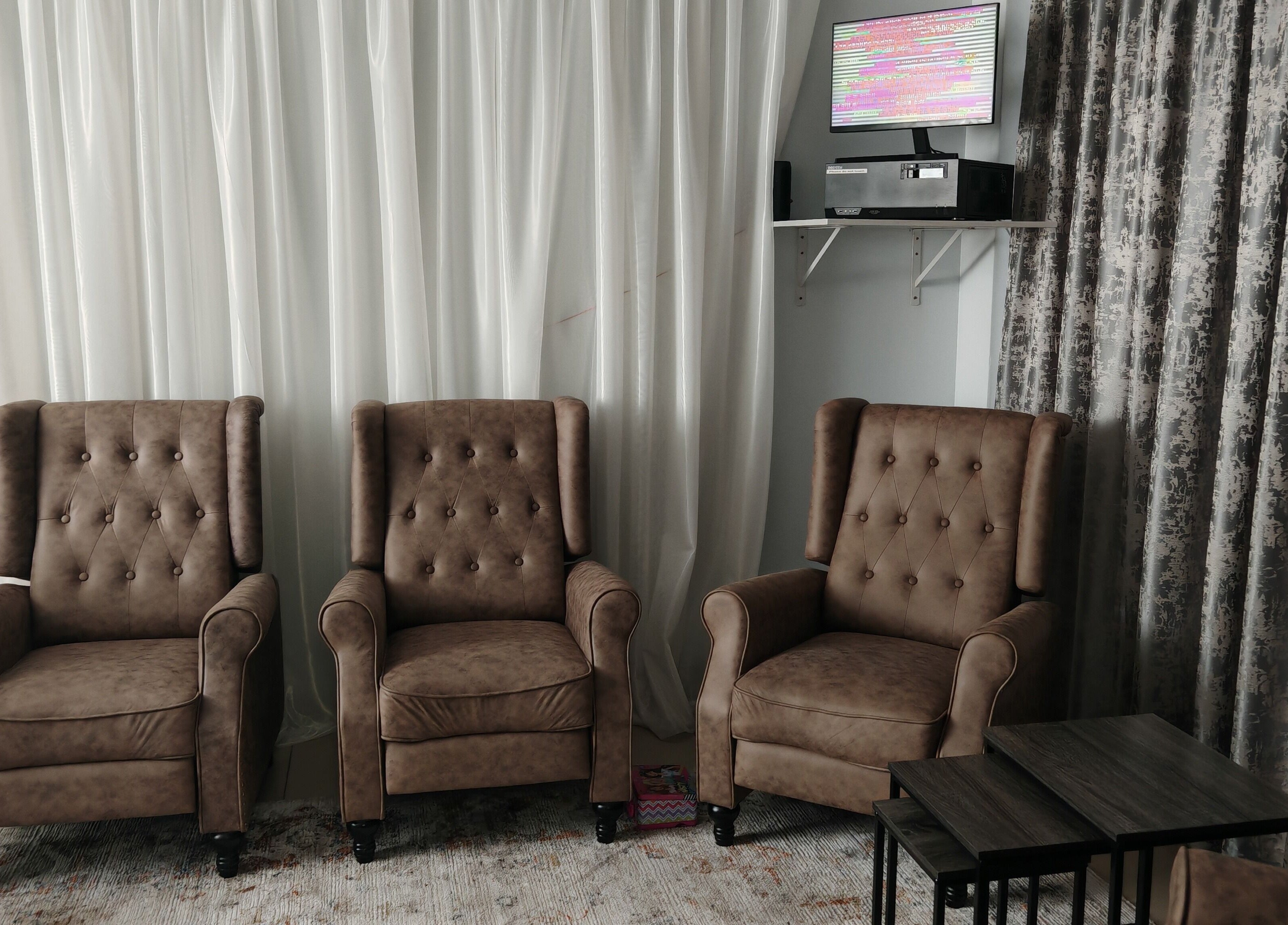 Cozy seating area with brown armchairs at Sozo Wellness, Mossel Bay, Western Cape, ZA.