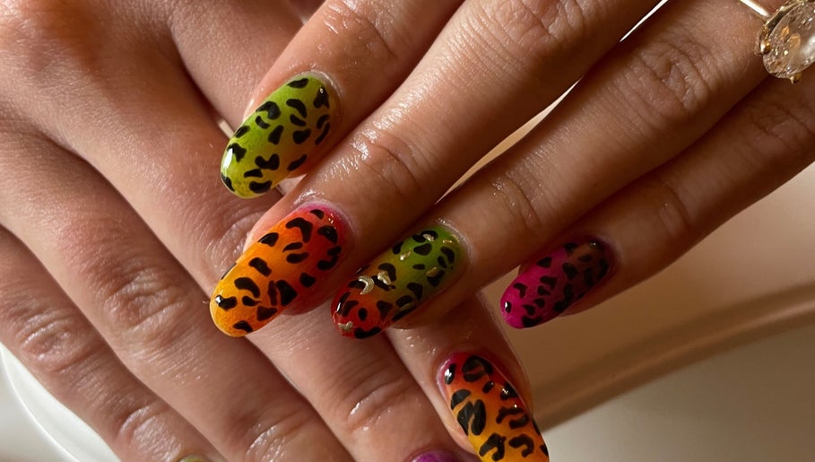 Vibrant leopard print nails at LSNAILBAR in Dumfries, Scotland, GB, showcasing artistic flair.