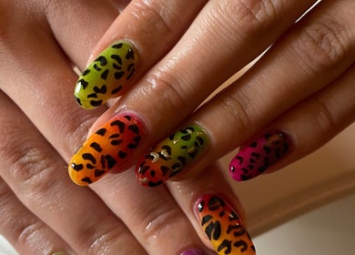 Vibrant leopard print nails at LSNAILBAR in Dumfries, Scotland, GB, showcasing artistic flair.