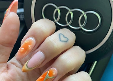 Stylish nail art at LSNAILBAR, Dumfries, Scotland, GB, showcasing vibrant orange and pink tones.